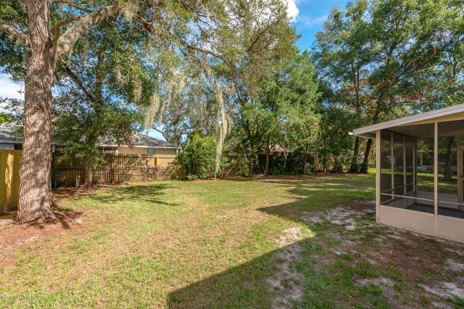 117 Tanager Road St. Augustine, FL 32086 - Photo 23 of 30 a view of a yard in front of a house with large trees