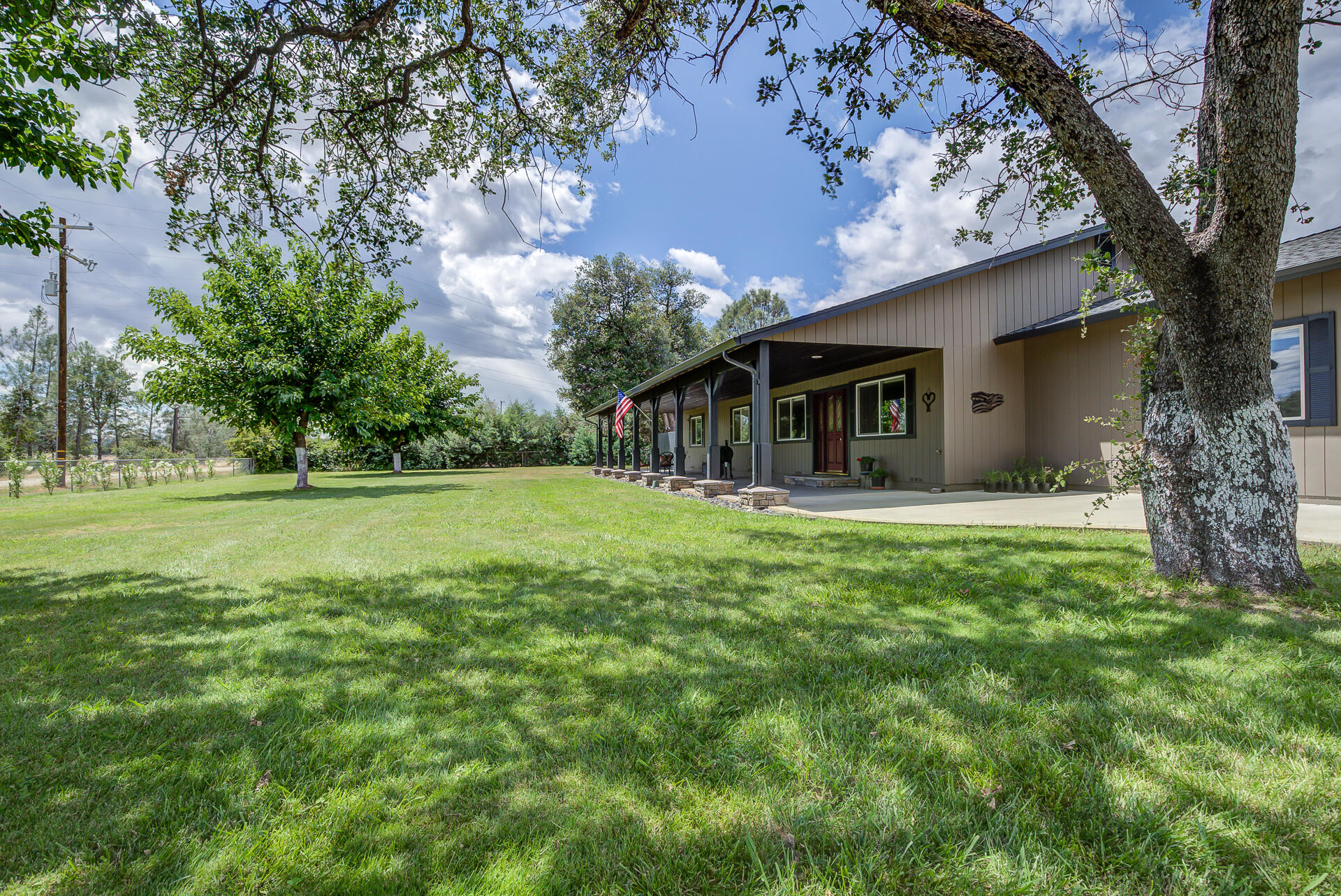 17536 Oly Way Anderson, CA 96007 - Photo 4 of 51 a house with huge green field in front of it