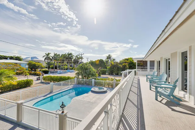 a view of a swimming pool with a patio