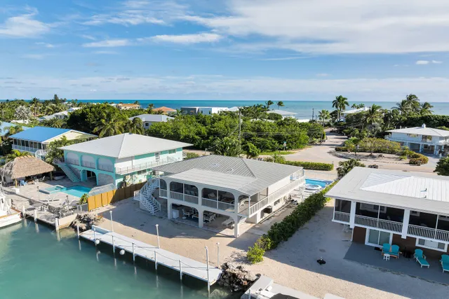 an aerial view of a house with a garden space