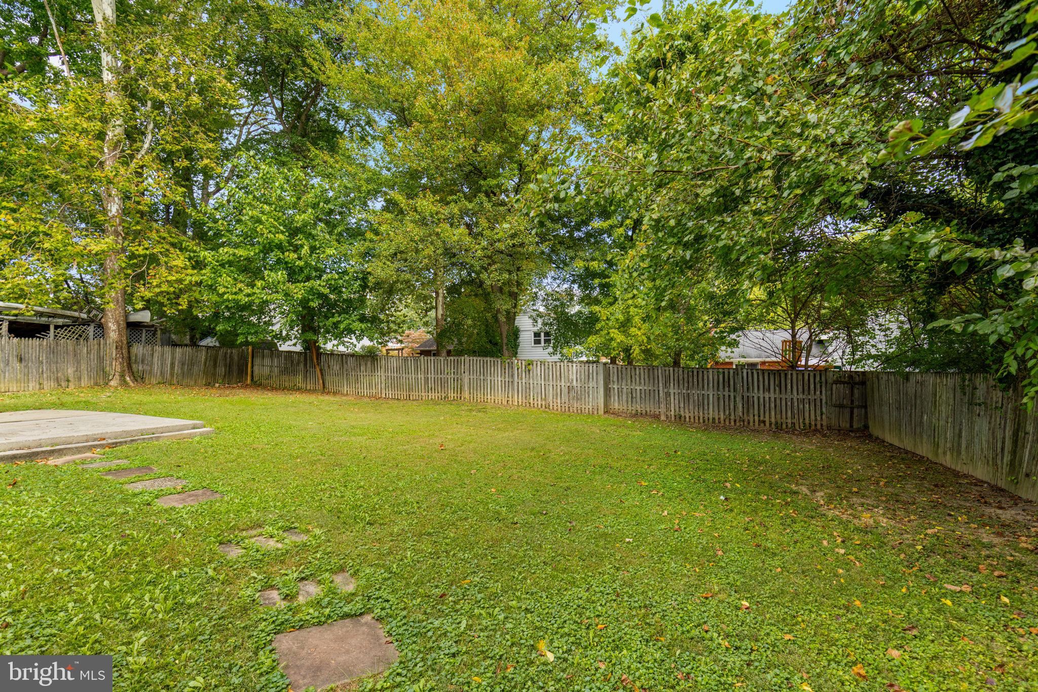 7414 Chatham Street Springfield, VA 22151 - Photo 31 of 34 a view of a backyard with a large trees
