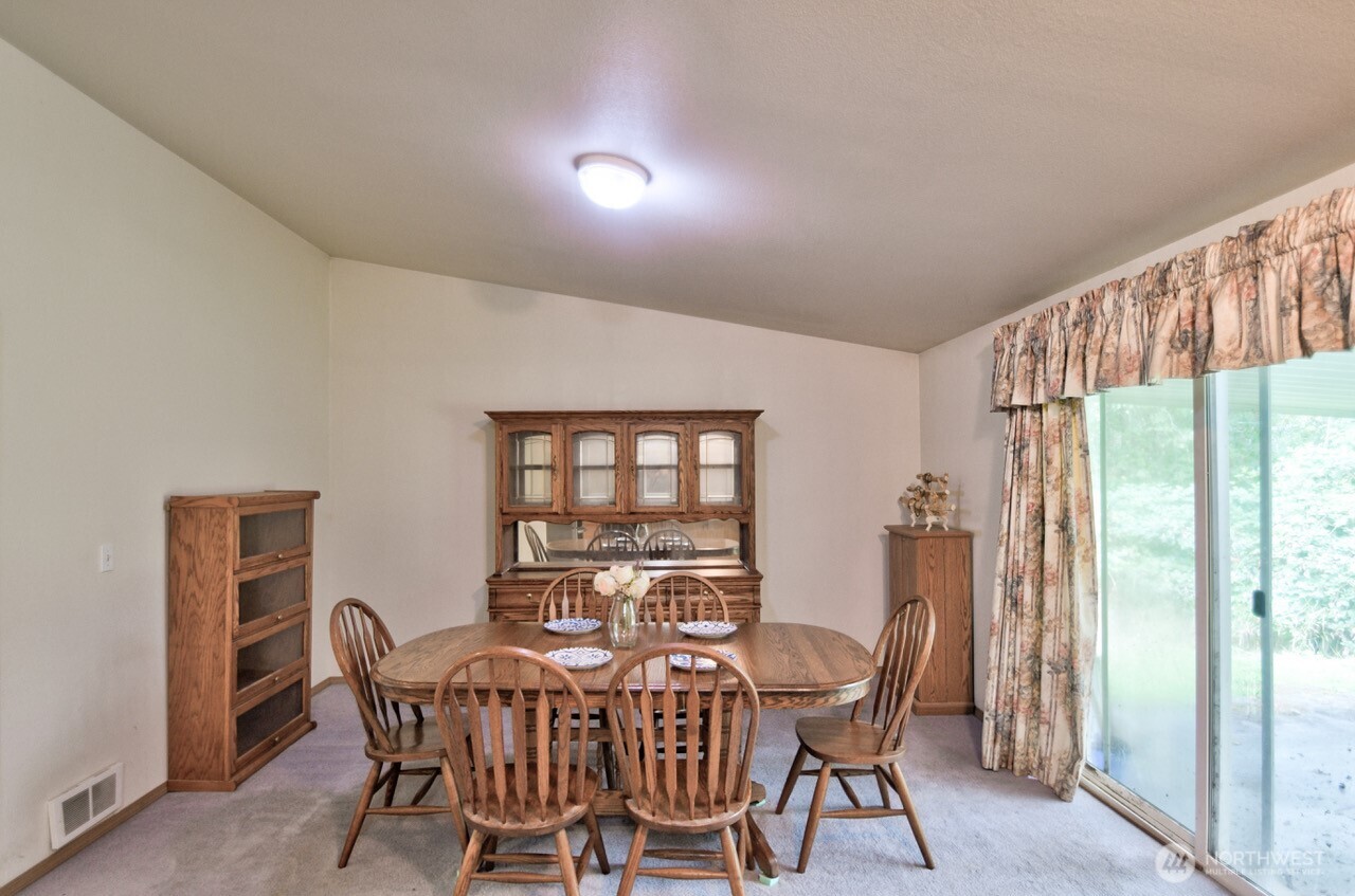 13920 Littlerock Road Southwest Rochester, WA 98579 - Photo 13 of 23 a view of a dining room with furniture window and outside view