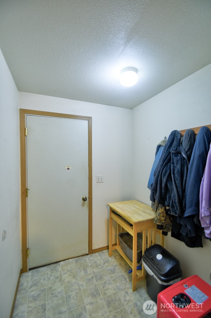 13920 Littlerock Road Southwest Rochester, WA 98579 - Photo 21 of 23 a room with storage and utility