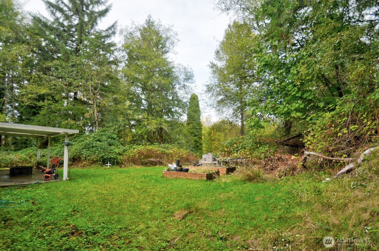 13920 Littlerock Road Southwest Rochester, WA 98579 - Photo 8 of 23 a garden view with a seating space