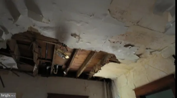 a view of a hallway with wooden shelves
