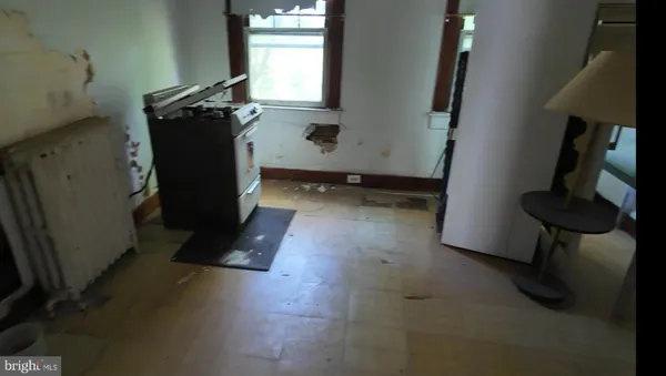 a view of storage and utility room with windows