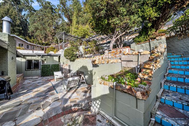 a view of a chairs and table in the patio