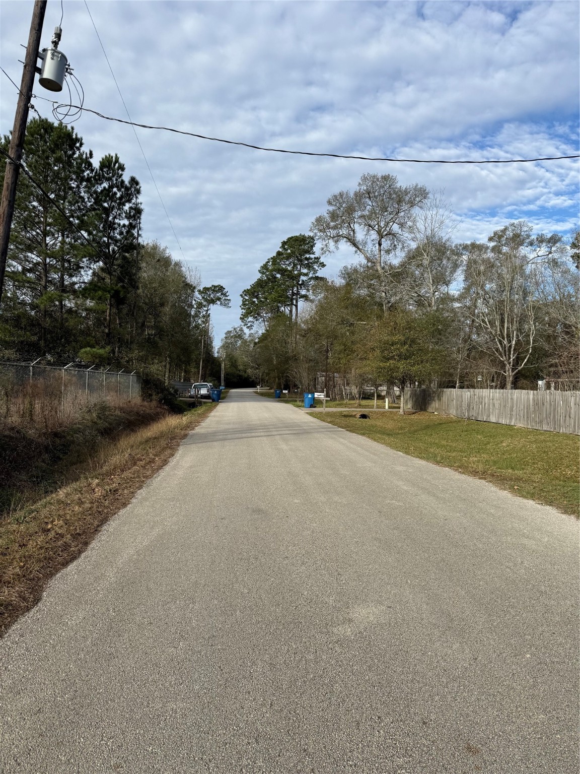 6830 Treeline Drive Humble, TX 77346 - Photo 10 of 12 a view of a road with a yard