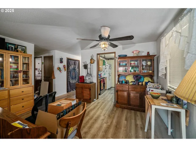 a open kitchen with stainless steel appliances granite countertop a refrigerator and a sink