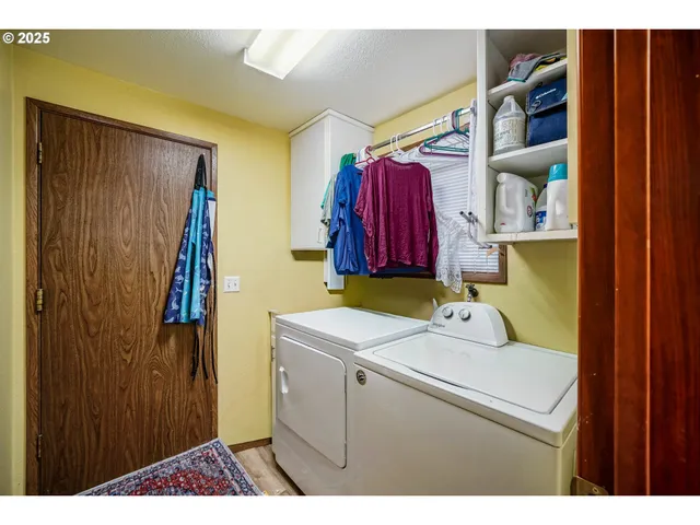 a kitchen with a window a sink and cabinets