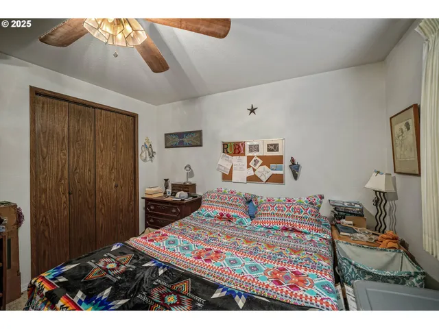 a living room with lots of furniture and a large window