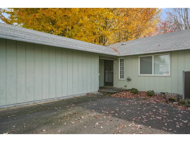 a view of a backyard of a house