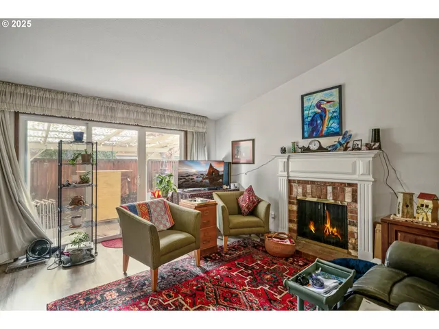 a view of walk in closet with clothes