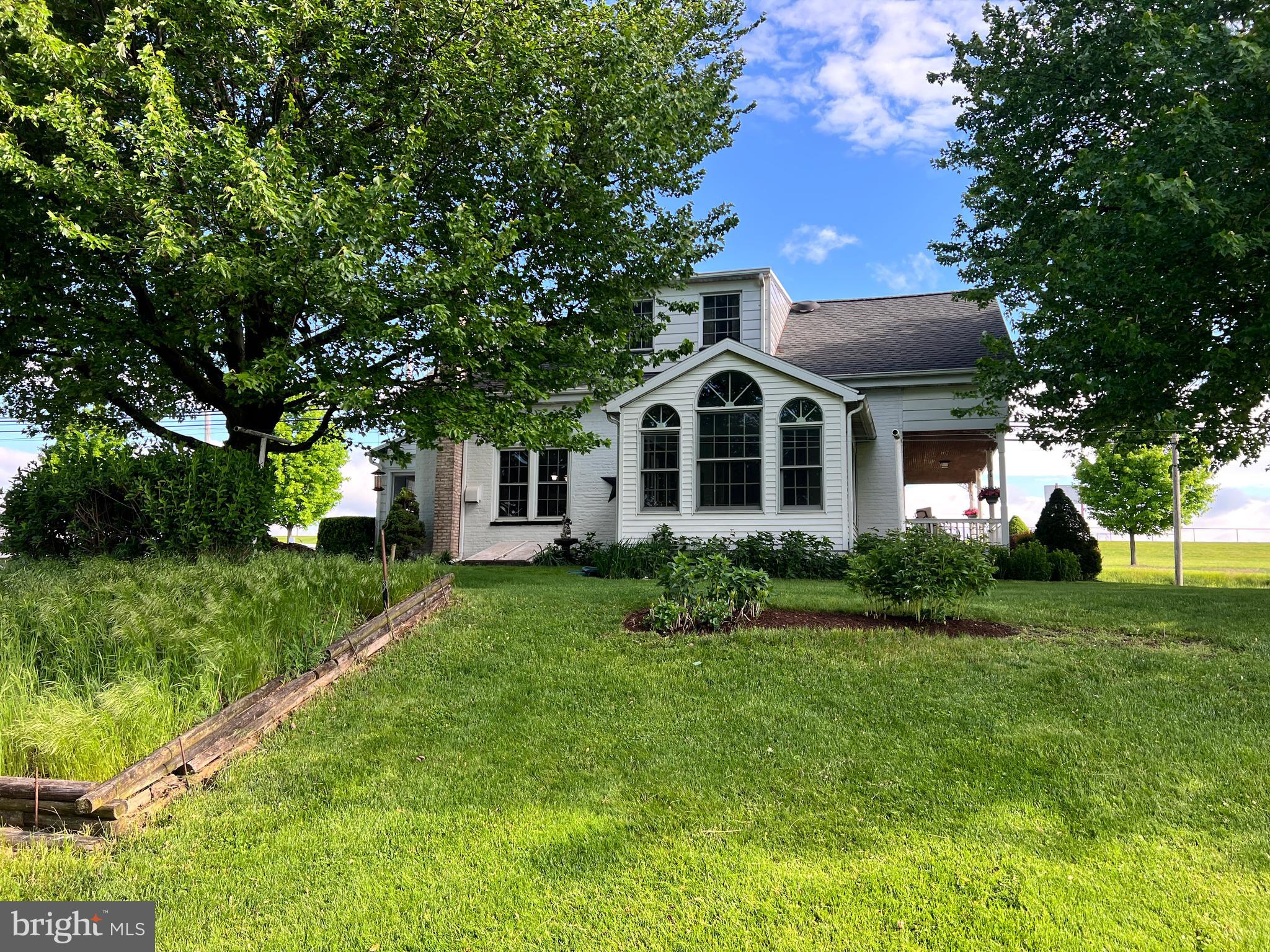 252 Doe Run Road Manheim, PA 17545 - Photo 4 of 32 a front view of a house with a yard