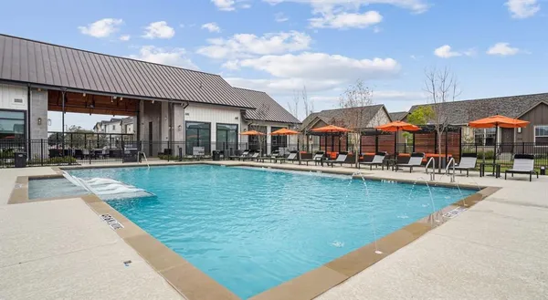 a view of a patio with swimming pool table and chairs