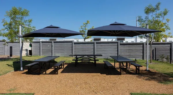 a front view of a house with a garden and yard