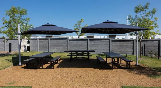 a front view of a house with a garden and yard