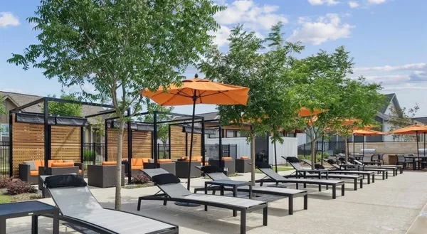 a outdoor living space with patio furniture and a couch