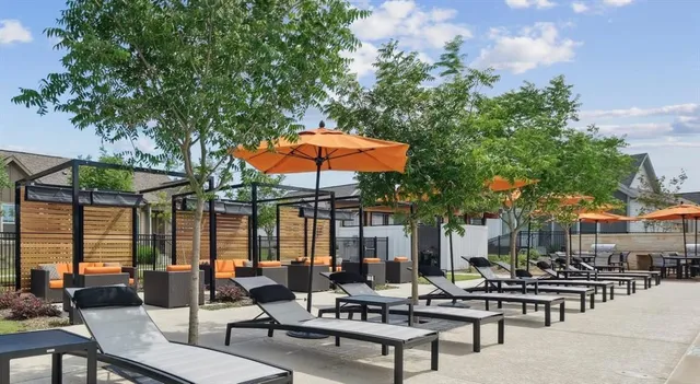 a outdoor living space with patio furniture and a couch