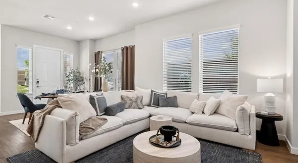 a living room with furniture and a large window