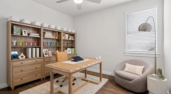 a reading room with furniture and a book shelf