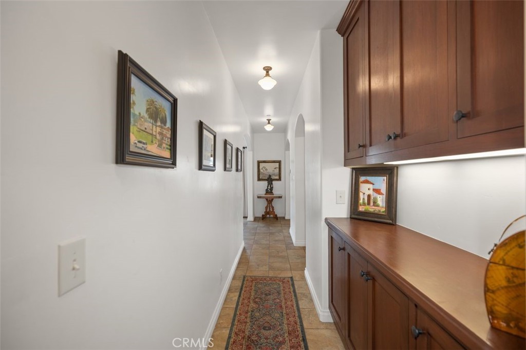 240 Avenida Rosa, Unit B San Clemente, CA 92672 - Photo 27 of 31 Hallway from bedroom and bathroom towards kitchen and living area.