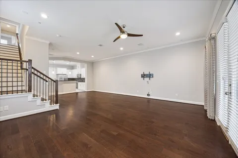 an entryway in hall with wooden floor