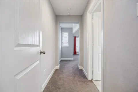 a view of a hallway with a white walls