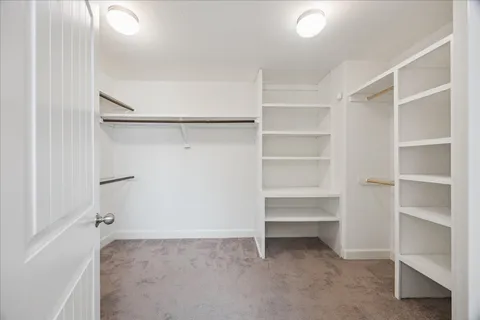 a view of an empty walk in closet