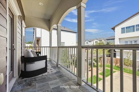 a view of a balcony with furniture