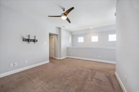 an empty room with a empty space and windows