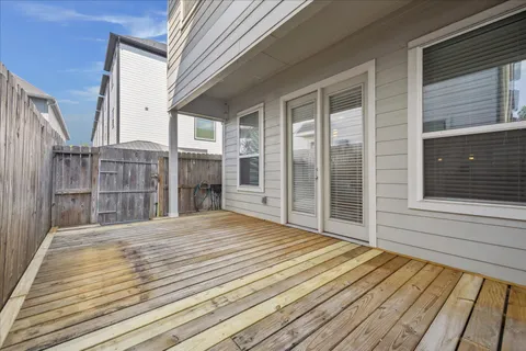 a view of backyard with large windows