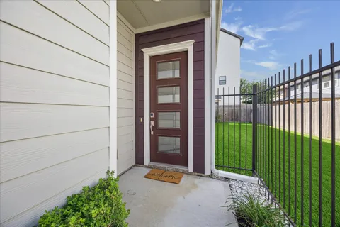 a view of a brick house with a large window