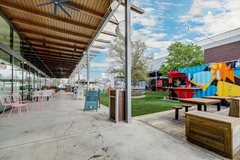 a view of a backyard with sitting area