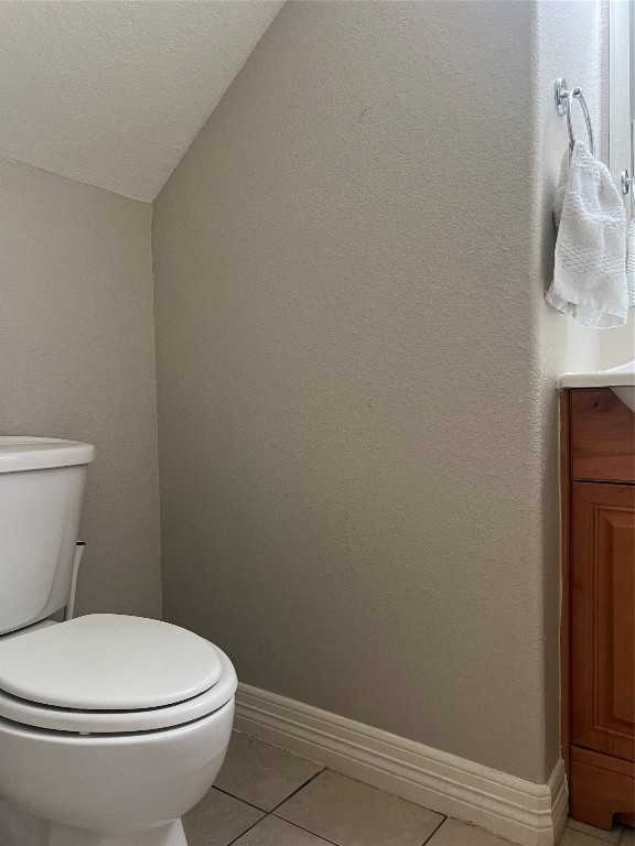 10902 Seneca Street Houston, TX 77016 - Photo 7 of 14 a white toilet sitting next to a white sink and vanity