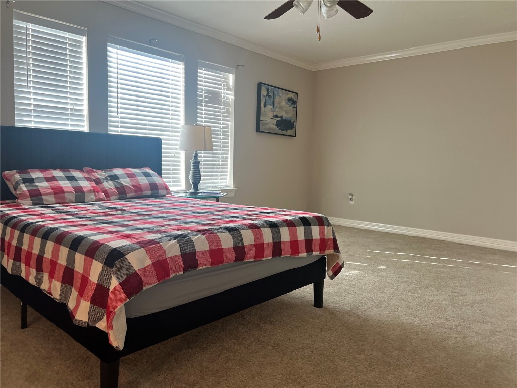 10902 Seneca Street Houston, TX 77016 - Photo 8 of 14 a bedroom with a bed and window