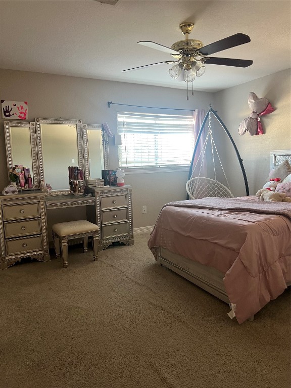 10902 Seneca Street Houston, TX 77016 - Photo 9 of 14 a bedroom with bed and a chandelier