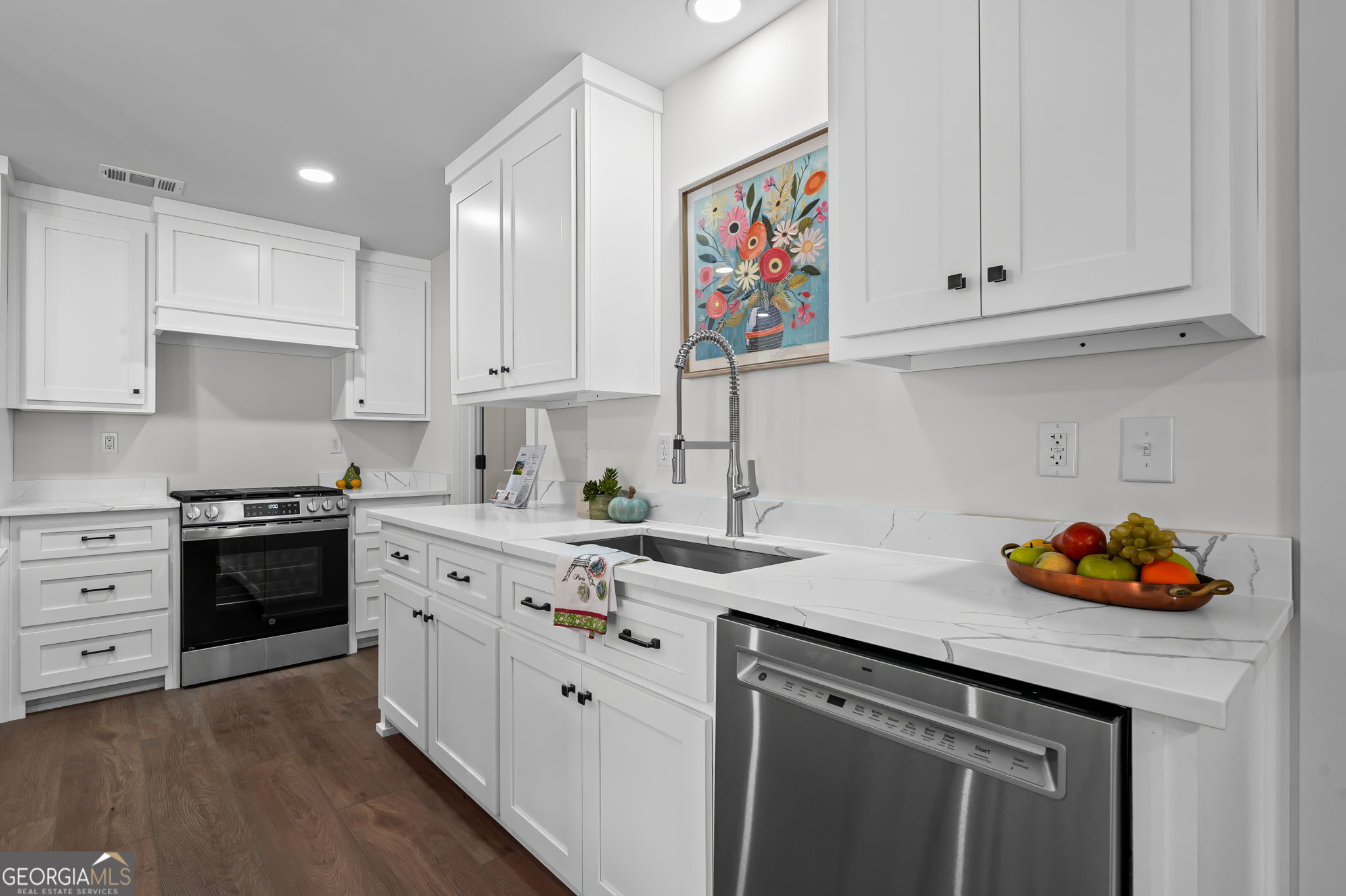 85 Franklin Road Newnan, GA 30263 - Photo 12 of 37 a kitchen with stainless steel appliances granite countertop a sink stove and cabinets