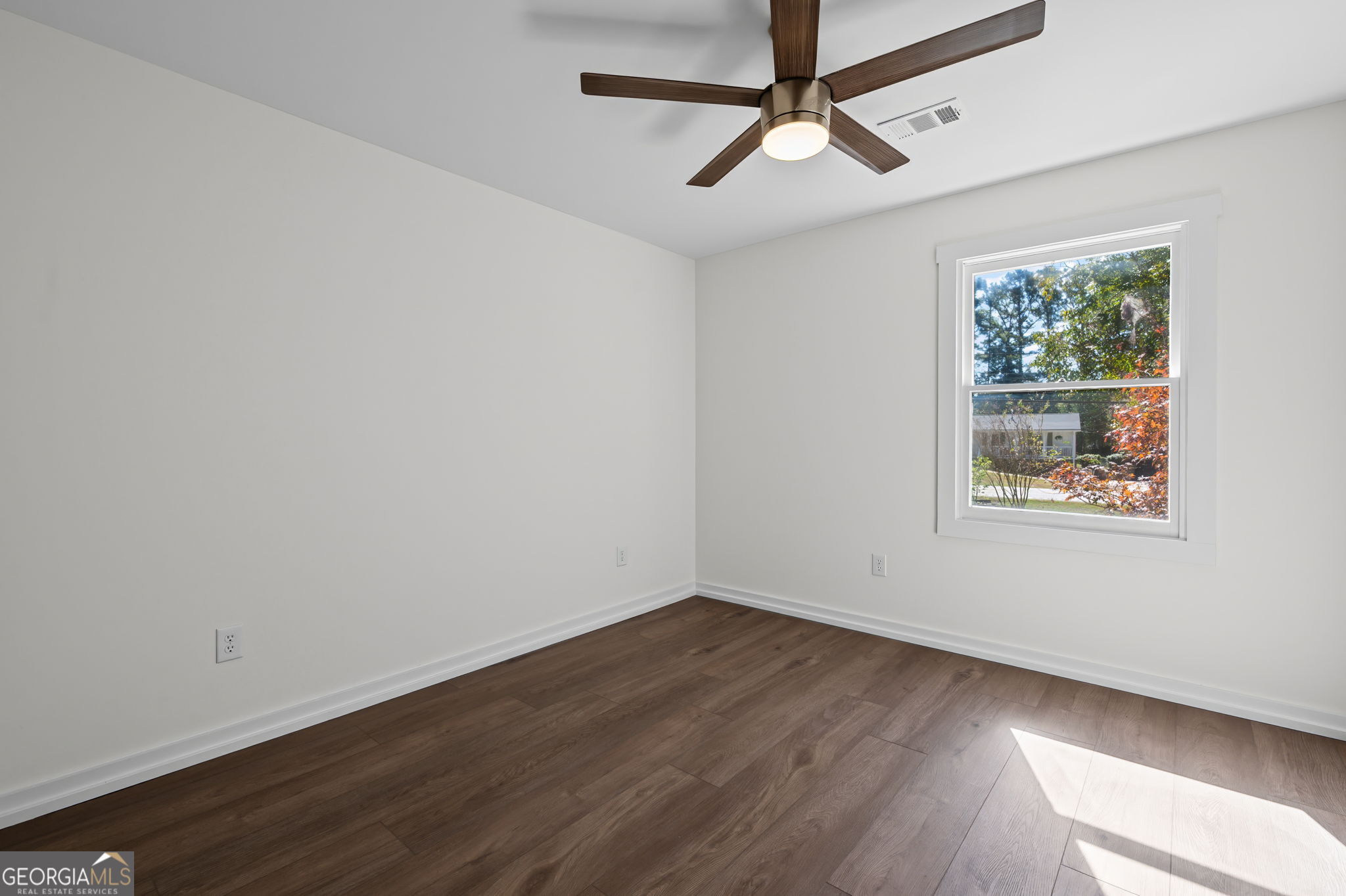 85 Franklin Road Newnan, GA 30263 - Photo 16 of 37 a view of a room with wooden floor and windows