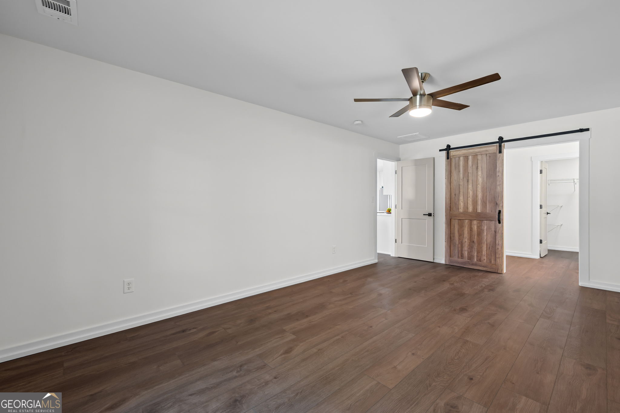85 Franklin Road Newnan, GA 30263 - Photo 21 of 37 a view of empty room with wooden floor and ceiling fan