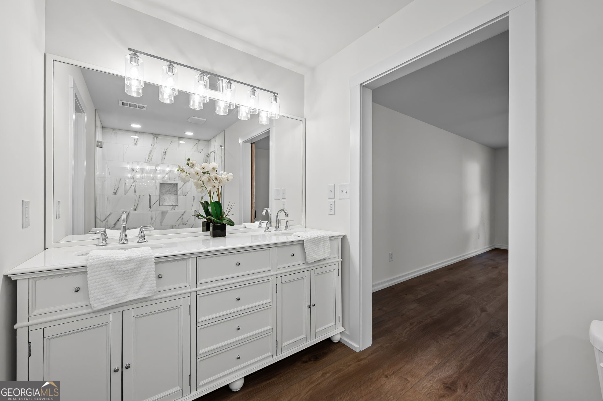85 Franklin Road Newnan, GA 30263 - Photo 24 of 37 a bathroom with a double vanity sink and mirror