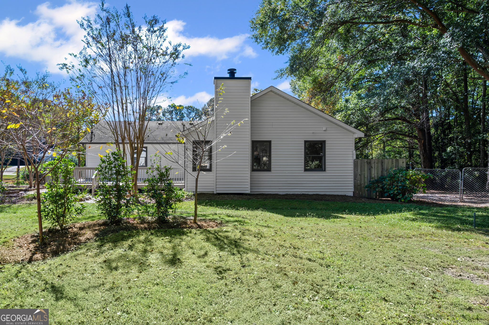 85 Franklin Road Newnan, GA 30263 - Photo 34 of 37 a view of a backyard with potted plants and large trees