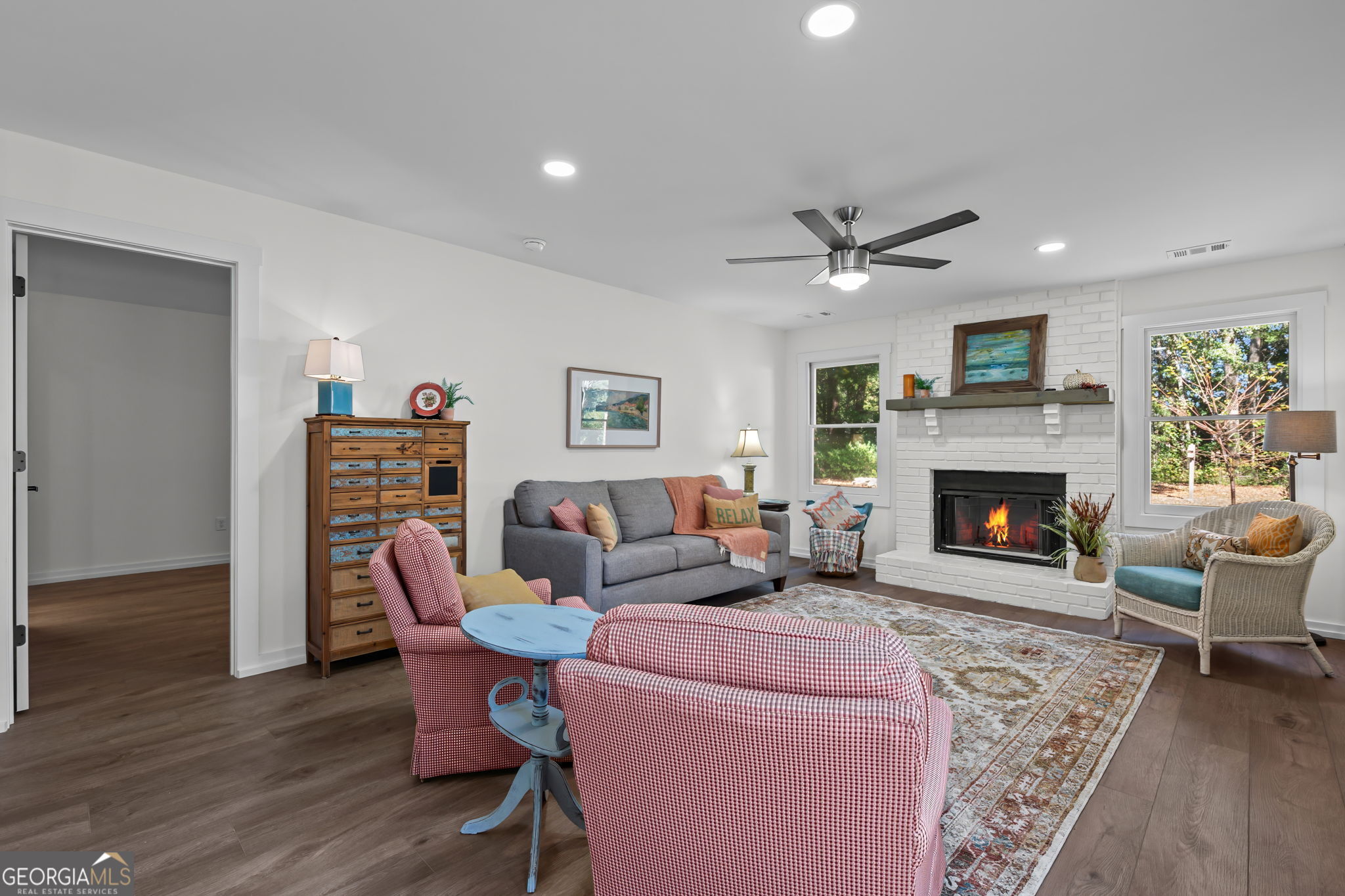 85 Franklin Road Newnan, GA 30263 - Photo 5 of 37 a living room with furniture a fireplace and wooden floor