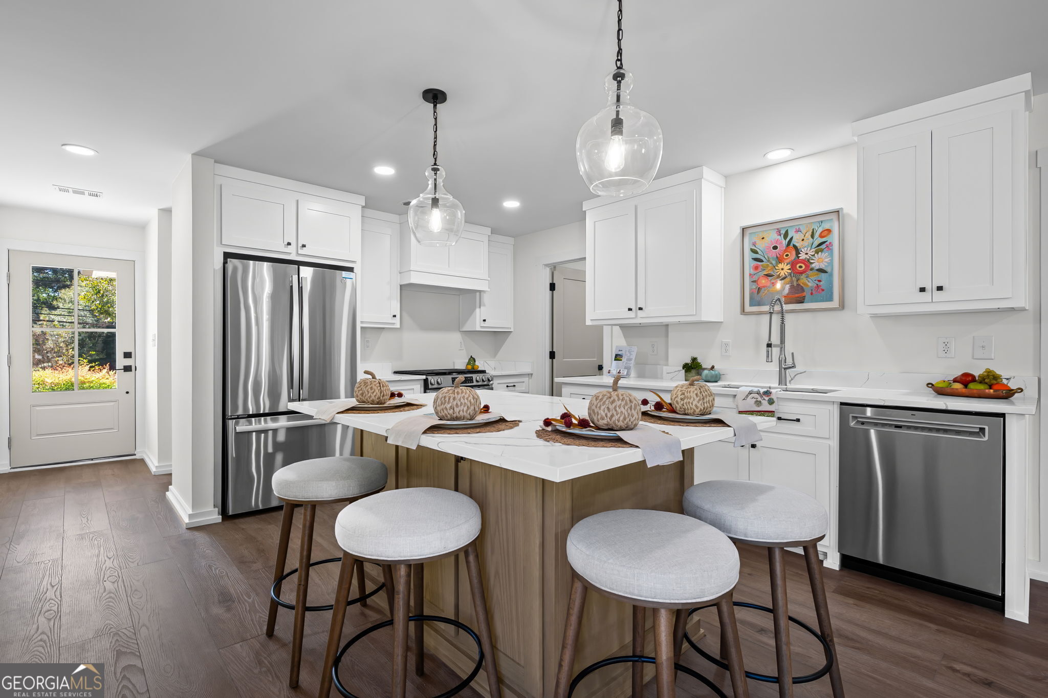 85 Franklin Road Newnan, GA 30263 - Photo 9 of 37 a kitchen with sink cabinets dining table and chairs