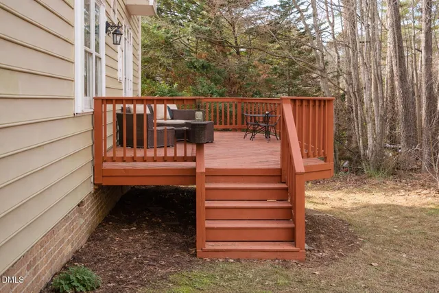 a bathroom with a tub shower sink and mirror
