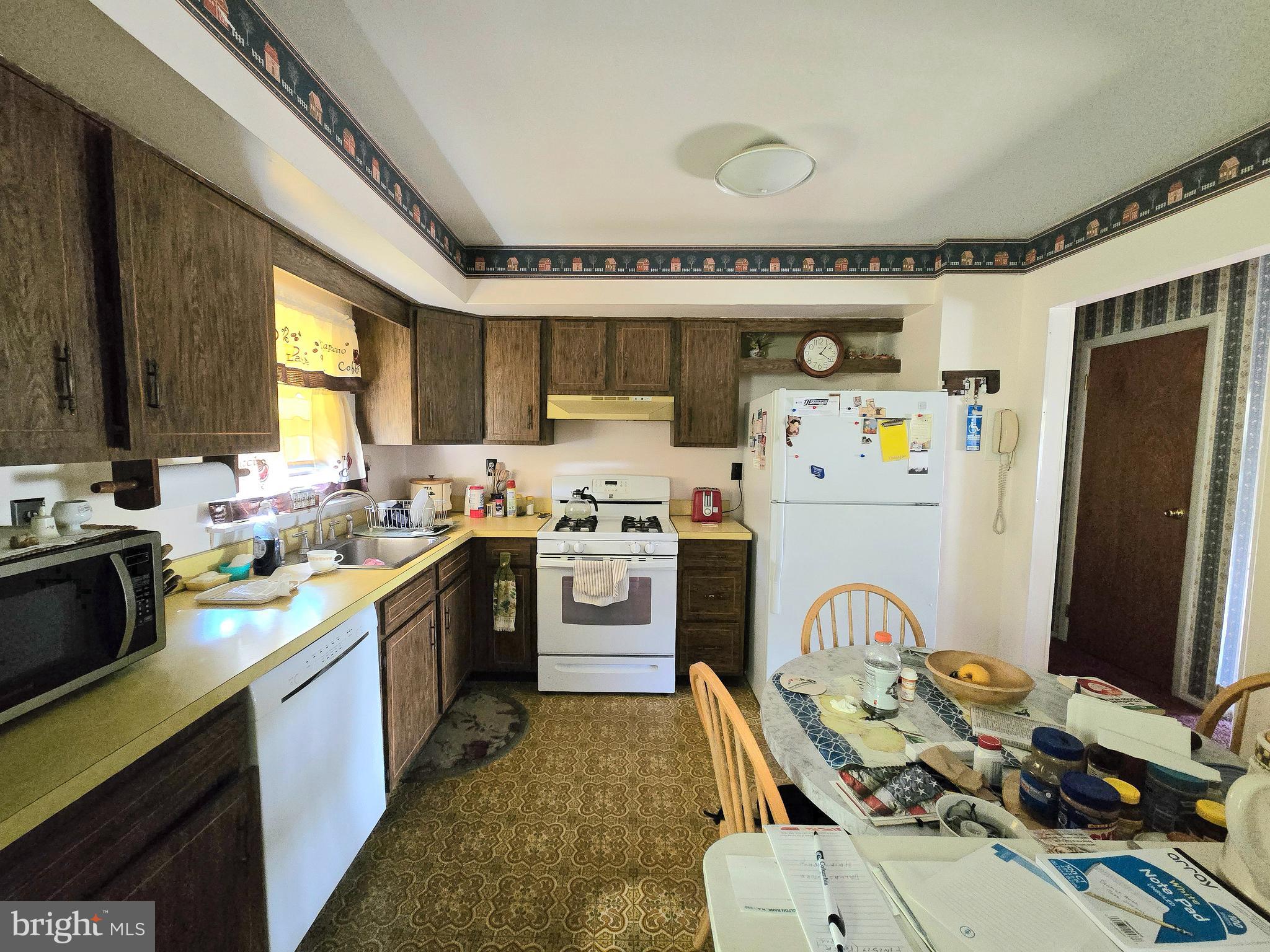 23 Dunham Loop Berlin, NJ 08009 - Photo 6 of 16 a kitchen that has a lot of cabinets a sink and appliances