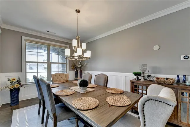 a living room with furniture fireplace and a large window