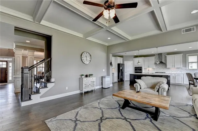 a dining room with a wooden table and chairs