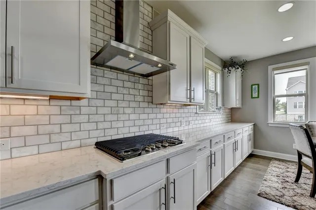 a view of an entryway with wooden floor and windows