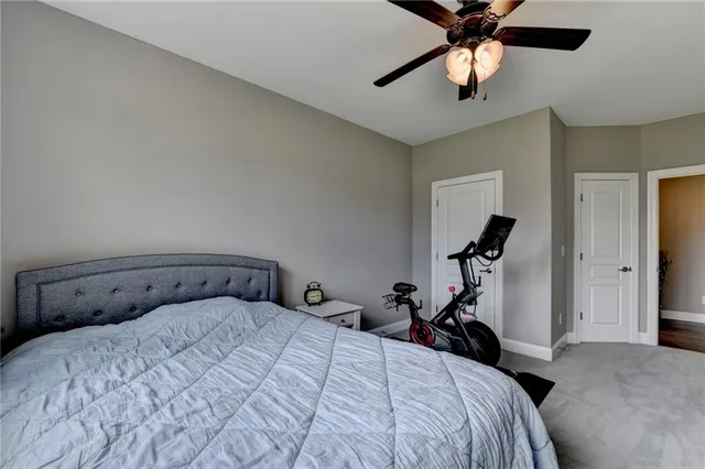 a bedroom with a bed and a tv on table